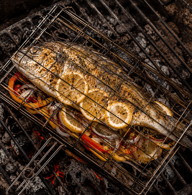 Fish cooking over a braai